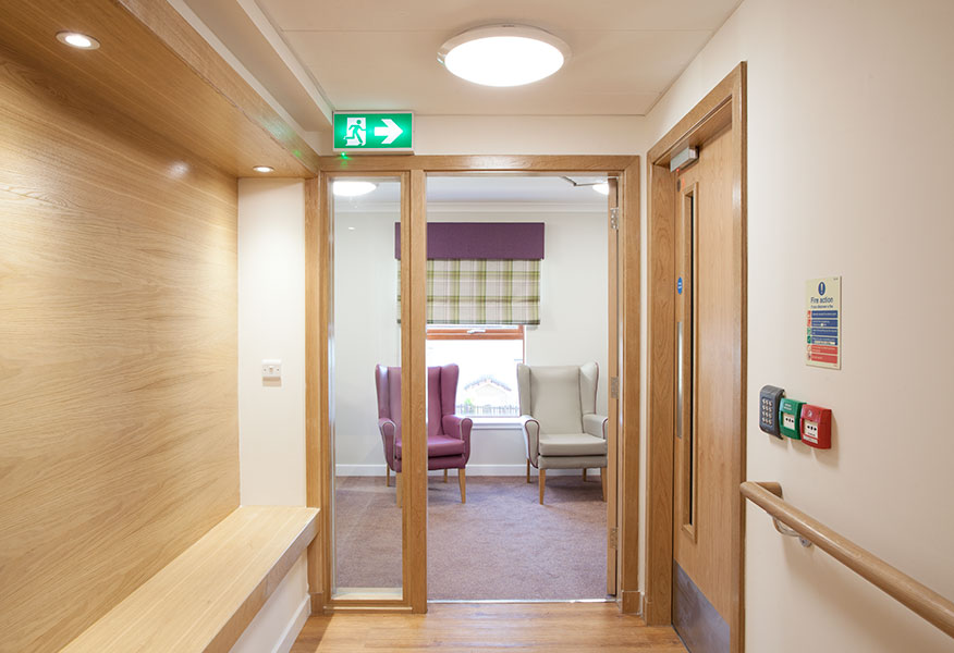 Tamlite Rosehall Care Home emergency exit LED lighting corridor and seating area