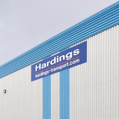 Tamlite Hardings Transport building exterior with company logo