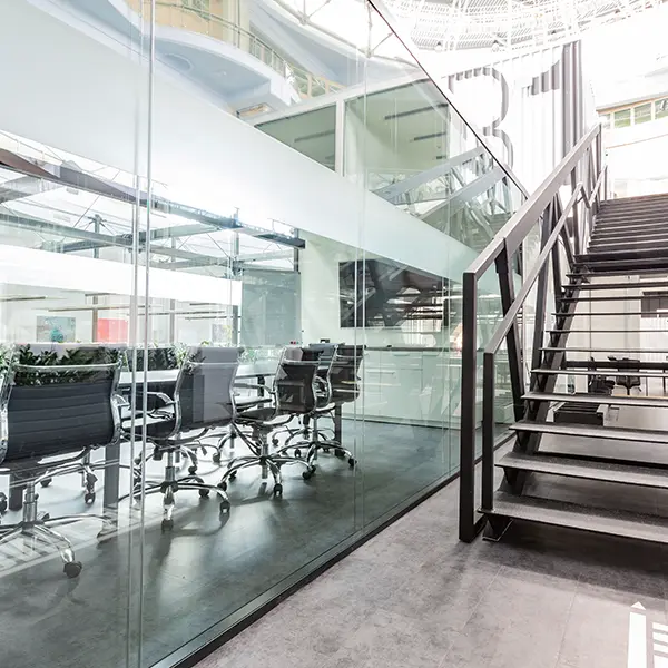data centre office lighting with open stairs and glass office